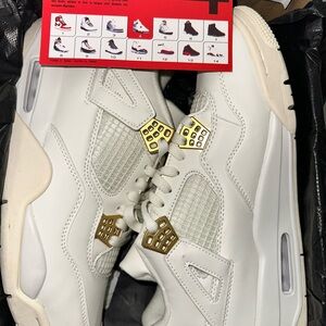 White Jordan 4 retro Sneakers with Gold Accents